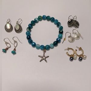 Starfish bracelet with assorted earrings.